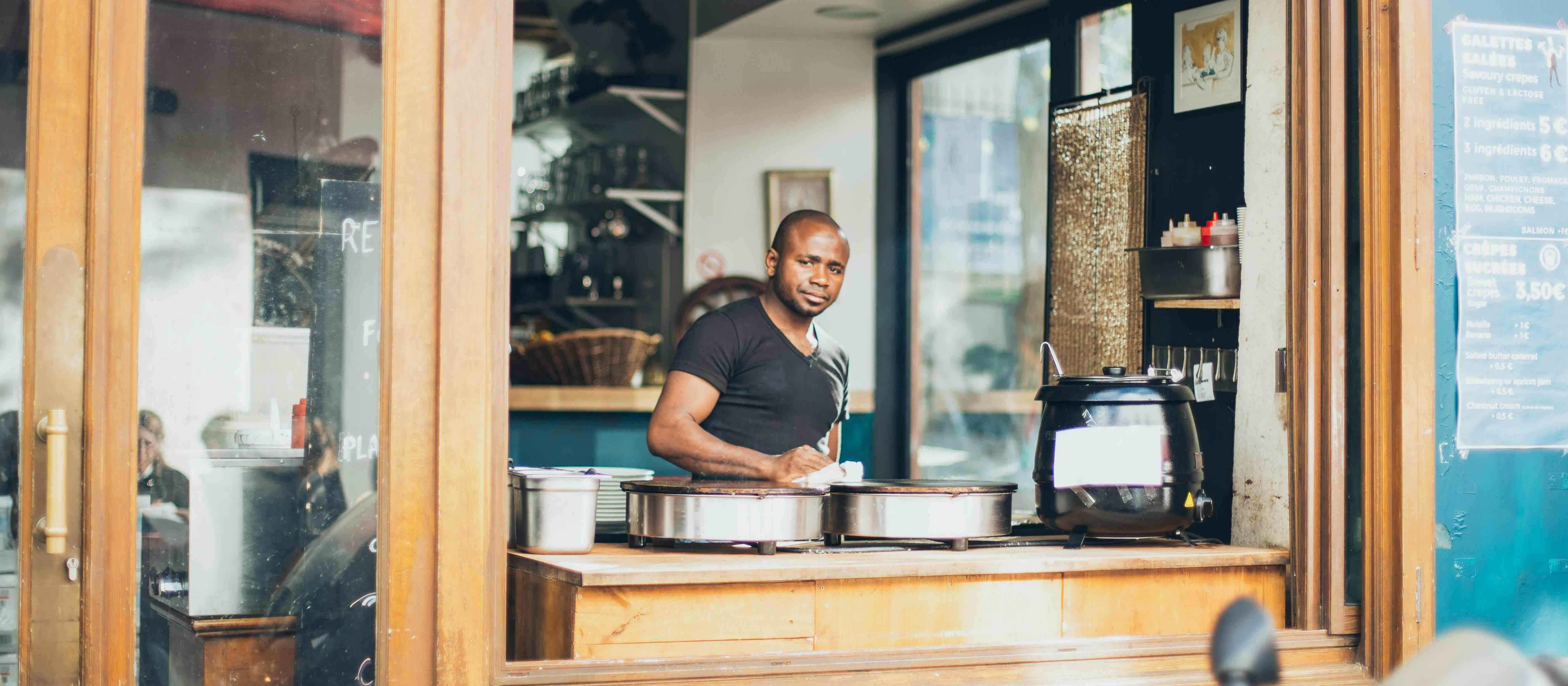 Business owner at a local shop accepting payments